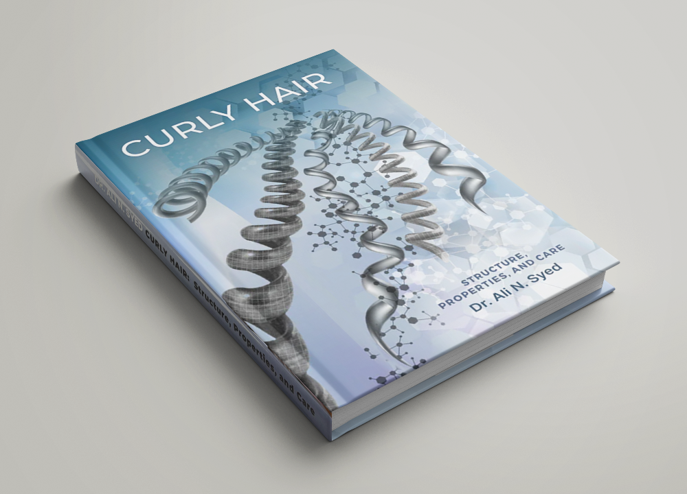 Un livre intitulé "Curly Hair" (cheveux bouclés) avec une représentation graphique de mèches de cheveux bouclés sur la couverture.