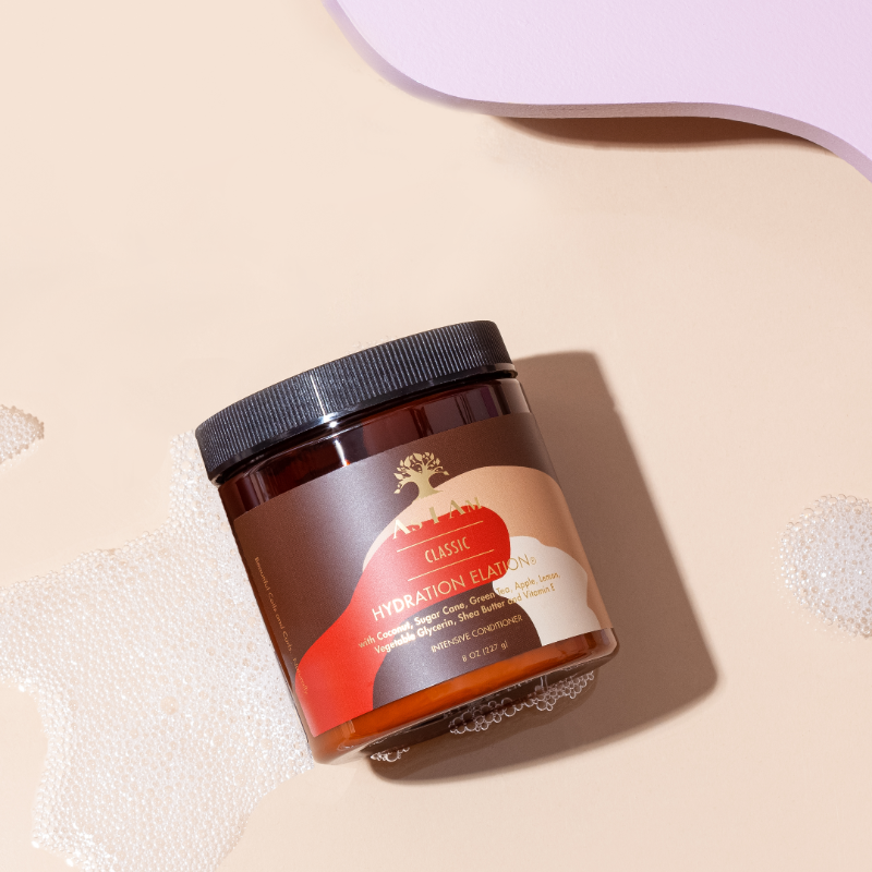 Classic Coconut Hydration Elation de As I Am, un après-shampoing profond hydratant intensif infusé de noix de coco pour des cheveux sains et nourris.