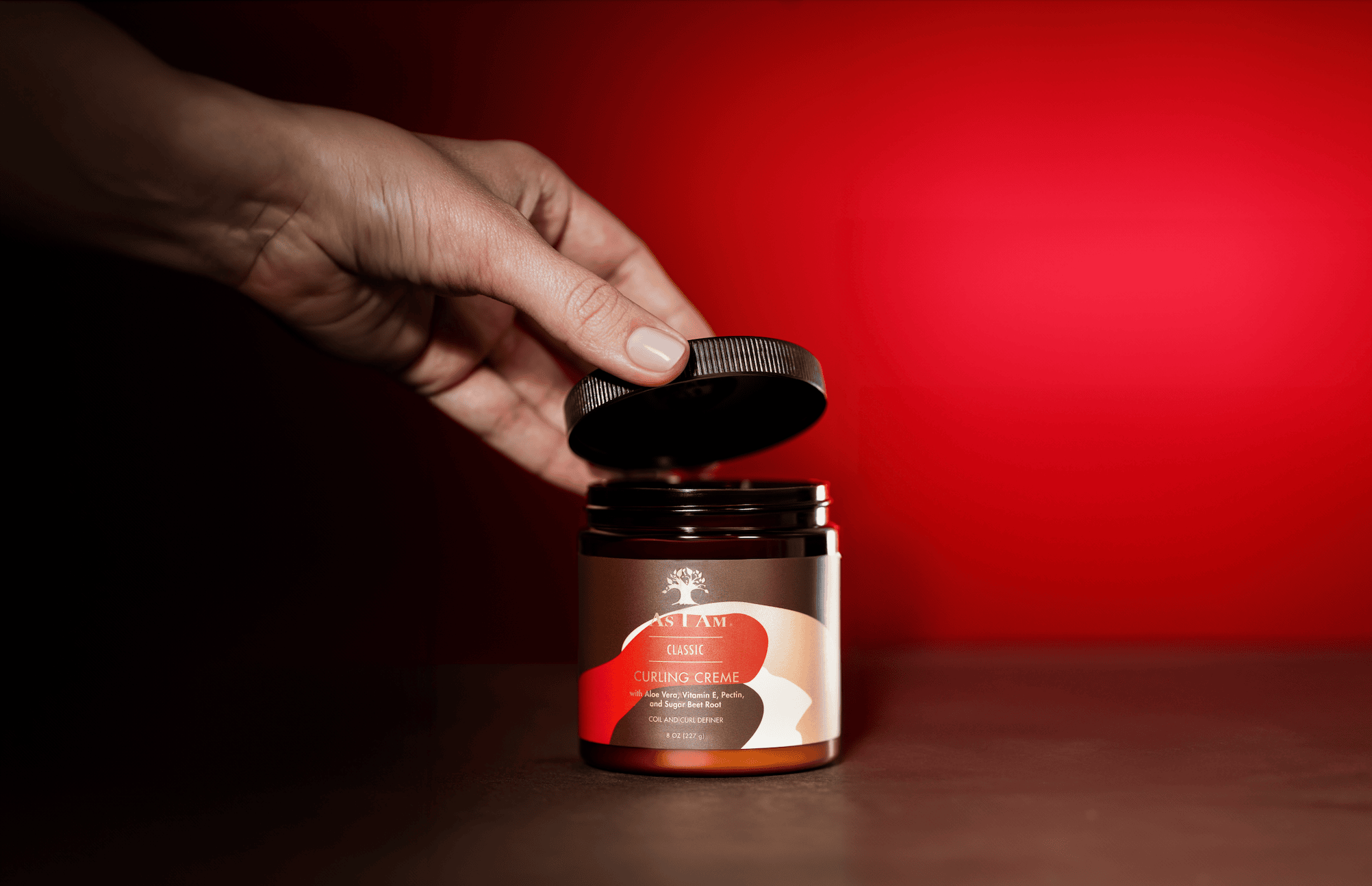 As I Am Curling Cream jar - une crème coiffante riche qui définit les boucles, ajoute de l'hydratation et offre une tenue souple aux cheveux de texture naturelle.
