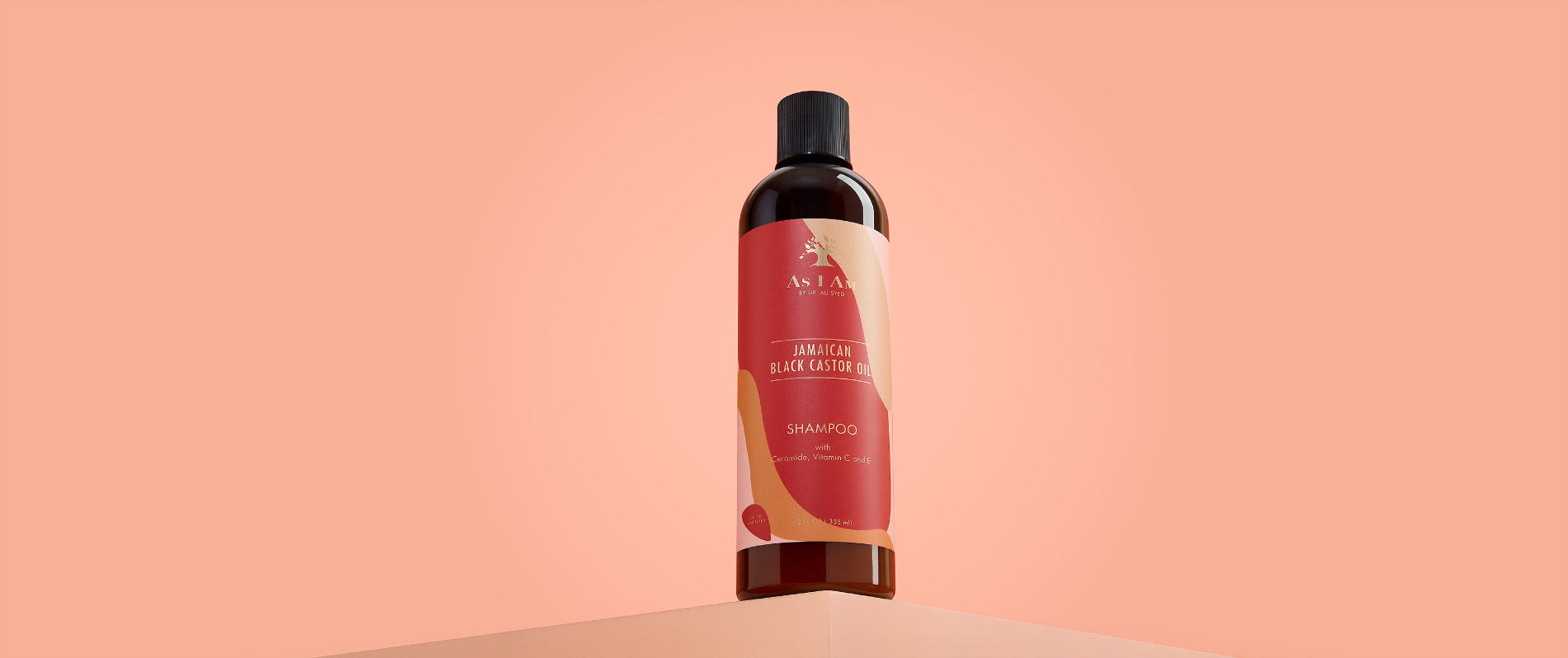 Shampooing à l'huile de ricin noire jamaïcaine As I Am - photo de paysage du nettoyant sans sulfate conçu pour renforcer et hydrater les cheveux tout en favorisant la santé du cuir chevelu.