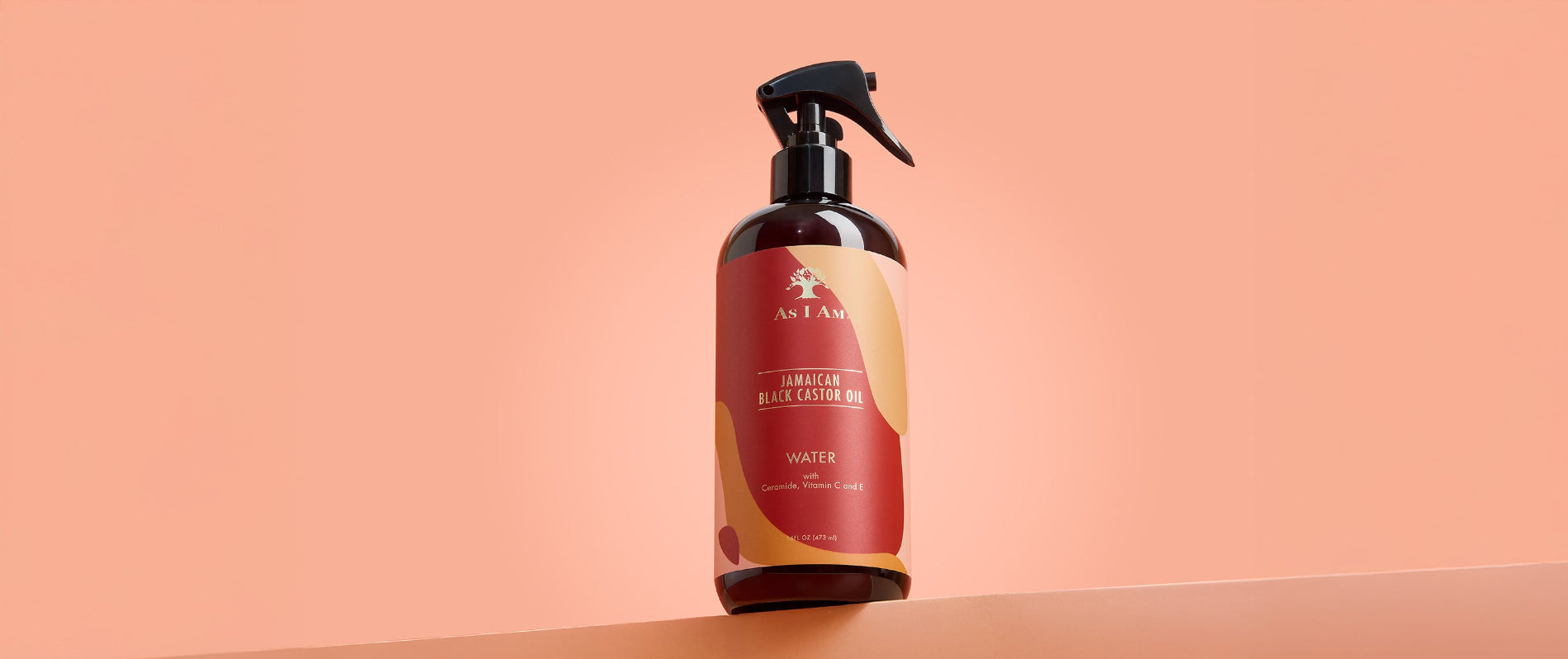 As I Am Jamaican Black Castor Oil Water - image du paysage du spray hydratant sans rinçage conçu pour rafraîchir les boucles, hydrater les cheveux secs et favoriser une croissance saine grâce à JBCO.