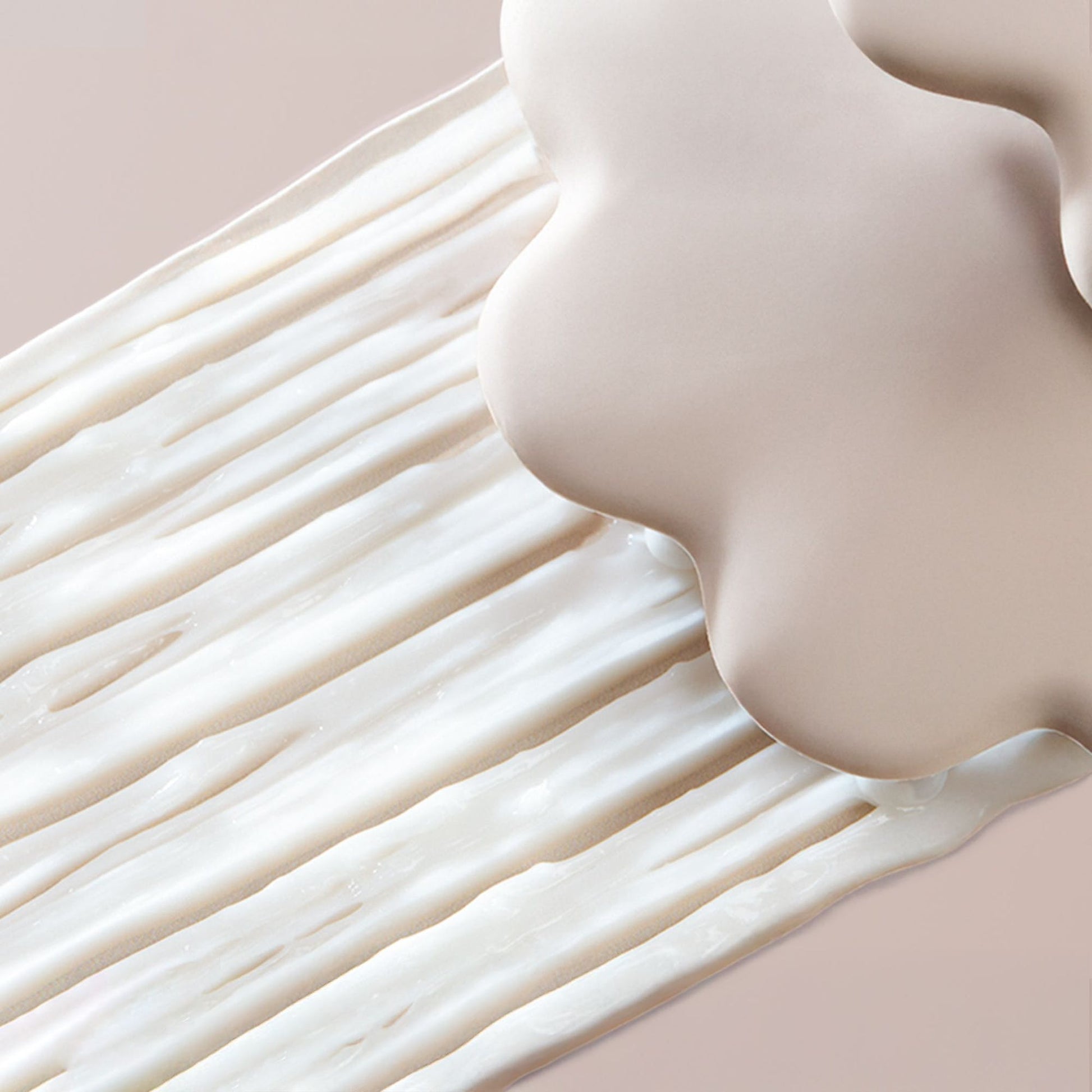 Gros plan d'une surface lisse, de couleur beige, avec un effet de flou artistique.