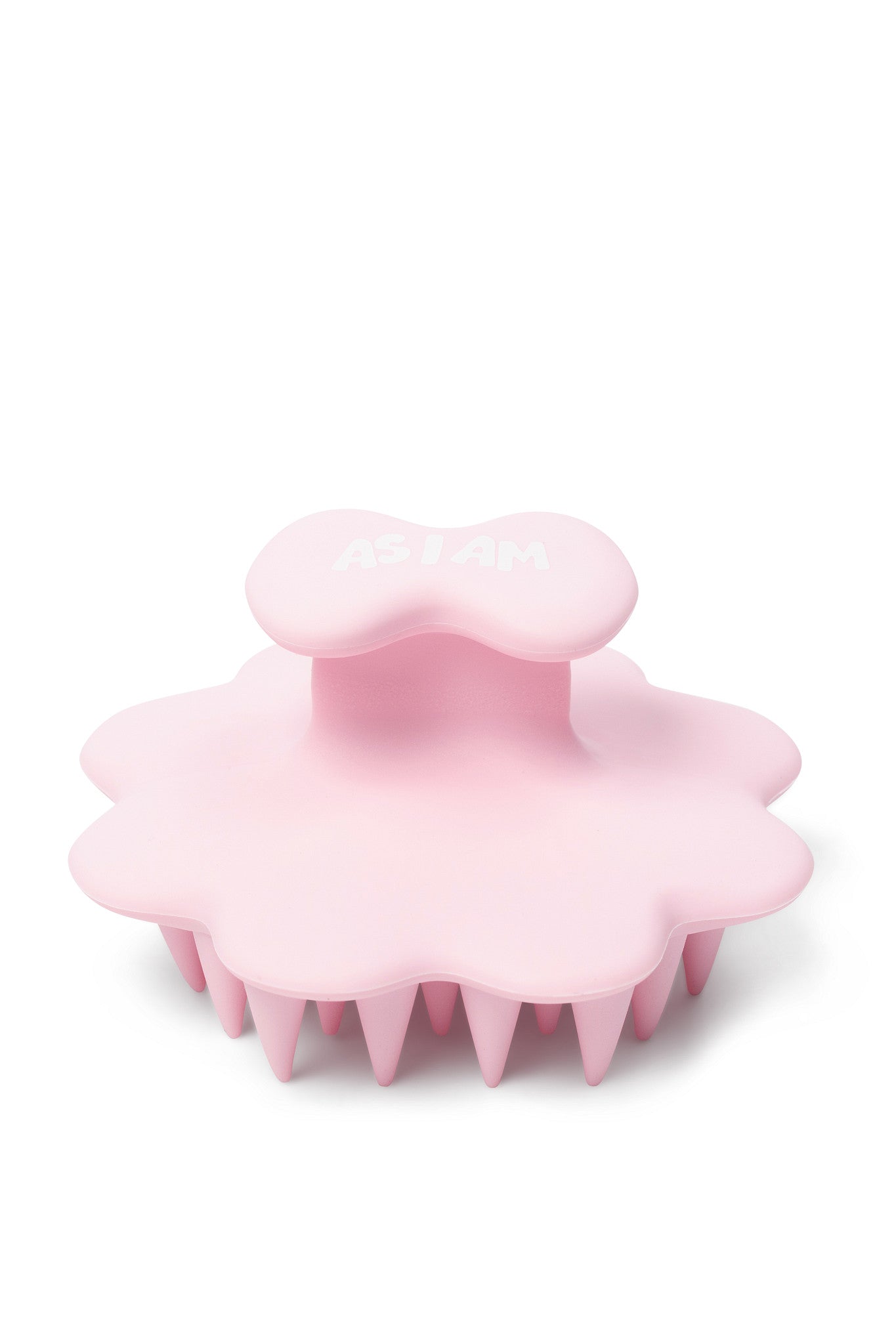 Éponge en silicone rose sur fond blanc
