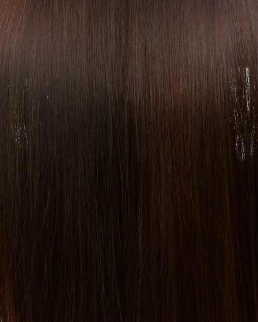 Gros plan sur la texture des cheveux brun foncé